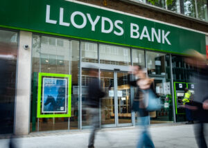  Lloyds profits squeezed as it braces for loan defaults amid rising interest rates