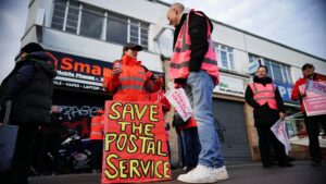  Royal Mail workers and lecturers walk out as winter strikes begin